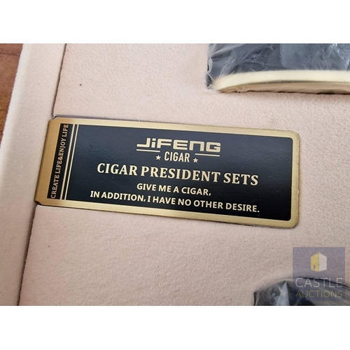 54 - JiFENG 'Cigar Presidents Sets'; An Impressive Cigar Accessory Gift Set Comprising Brass Colour Metal... 