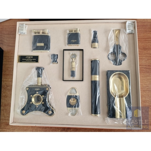 54 - JiFENG 'Cigar Presidents Sets'; An Impressive Cigar Accessory Gift Set Comprising Brass Colour Metal... 