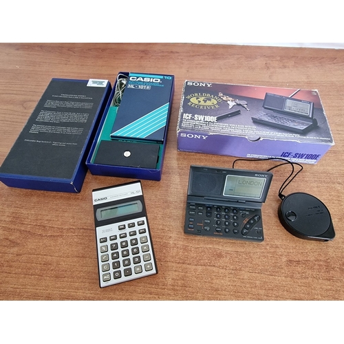 709F - SONY Worldband Receiver (ICF-SW100E), Both in Original Boxes, Together with 'Calculator Bug System Z... 