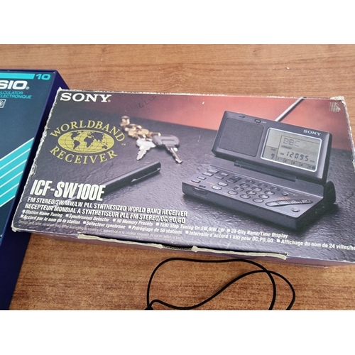 709F - SONY Worldband Receiver (ICF-SW100E), Both in Original Boxes, Together with 'Calculator Bug System Z... 