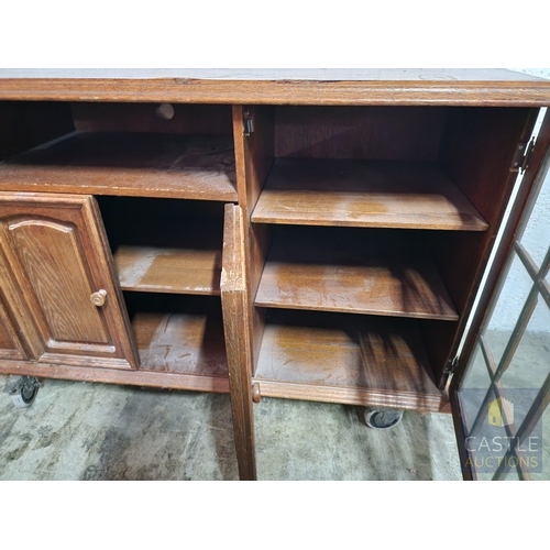367 - Solid Wood TV Unit on Wheels, with CD Cupboard, Media Shelf Over Double Cupboard and Glazed Door to ... 