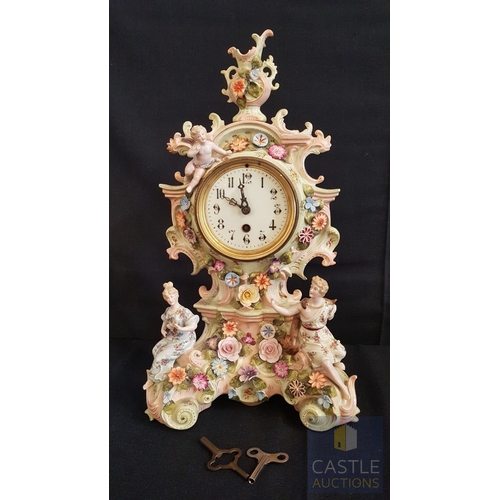 1 - A Decorative Continental Porcelain Mantel Clock, Richly Modelled with Applied Flowers, Scrollwork an... 