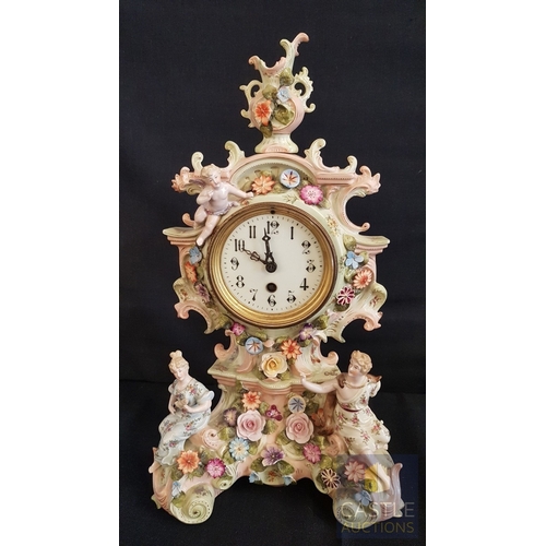1 - A Decorative Continental Porcelain Mantel Clock, Richly Modelled with Applied Flowers, Scrollwork an... 