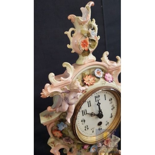 1 - A Decorative Continental Porcelain Mantel Clock, Richly Modelled with Applied Flowers, Scrollwork an... 