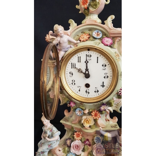 1 - A Decorative Continental Porcelain Mantel Clock, Richly Modelled with Applied Flowers, Scrollwork an... 