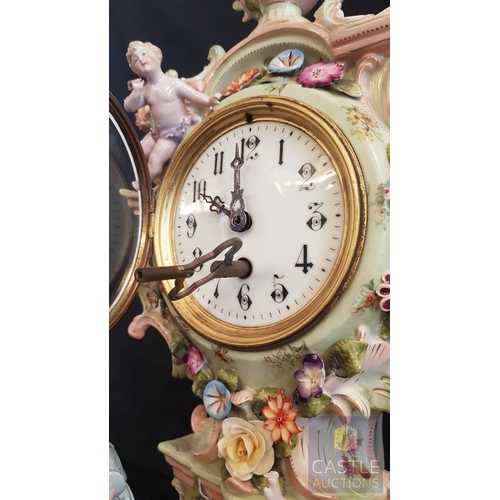 1 - A Decorative Continental Porcelain Mantel Clock, Richly Modelled with Applied Flowers, Scrollwork an... 