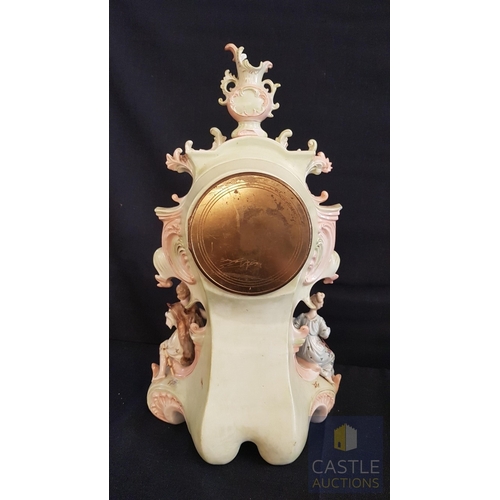 1 - A Decorative Continental Porcelain Mantel Clock, Richly Modelled with Applied Flowers, Scrollwork an... 