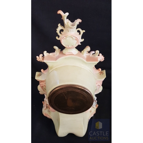 1 - A Decorative Continental Porcelain Mantel Clock, Richly Modelled with Applied Flowers, Scrollwork an... 