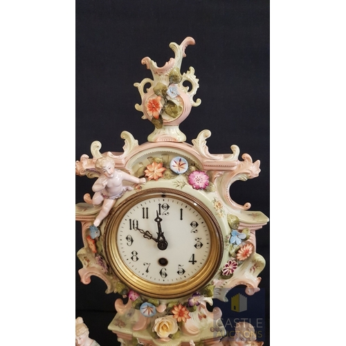 1 - A Decorative Continental Porcelain Mantel Clock, Richly Modelled with Applied Flowers, Scrollwork an... 