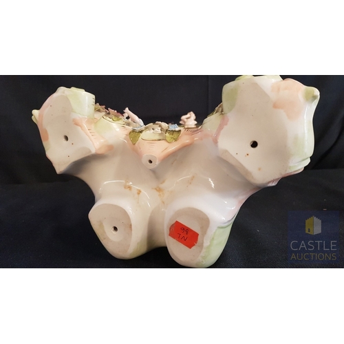 1 - A Decorative Continental Porcelain Mantel Clock, Richly Modelled with Applied Flowers, Scrollwork an... 