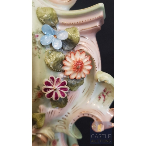 1 - A Decorative Continental Porcelain Mantel Clock, Richly Modelled with Applied Flowers, Scrollwork an... 