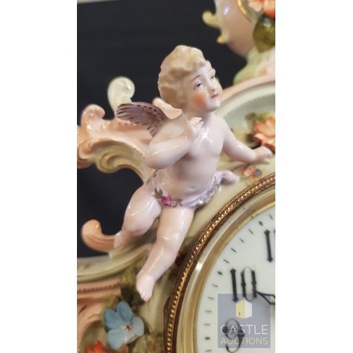 1 - A Decorative Continental Porcelain Mantel Clock, Richly Modelled with Applied Flowers, Scrollwork an... 