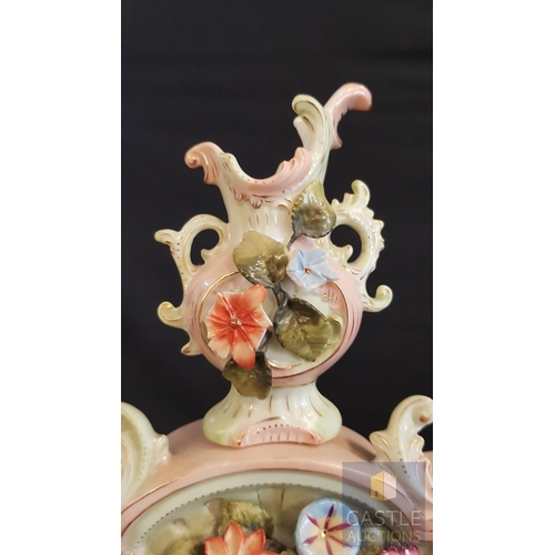 1 - A Decorative Continental Porcelain Mantel Clock, Richly Modelled with Applied Flowers, Scrollwork an... 