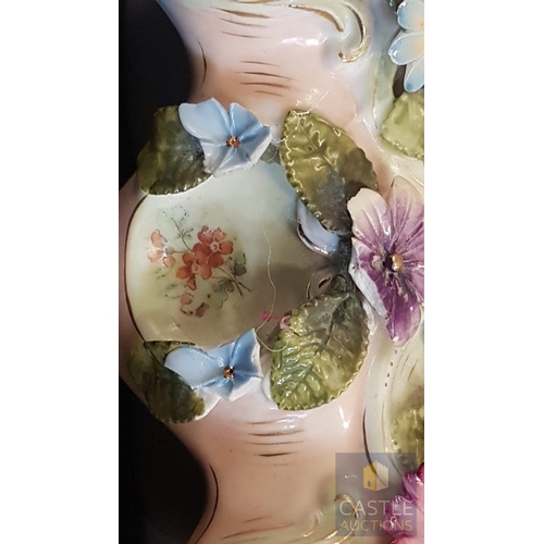 1 - A Decorative Continental Porcelain Mantel Clock, Richly Modelled with Applied Flowers, Scrollwork an... 