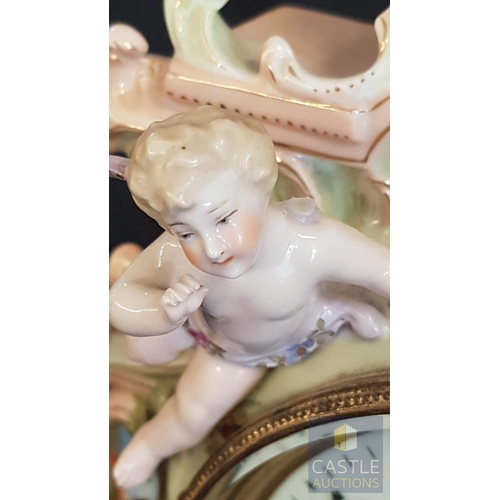 1 - A Decorative Continental Porcelain Mantel Clock, Richly Modelled with Applied Flowers, Scrollwork an... 