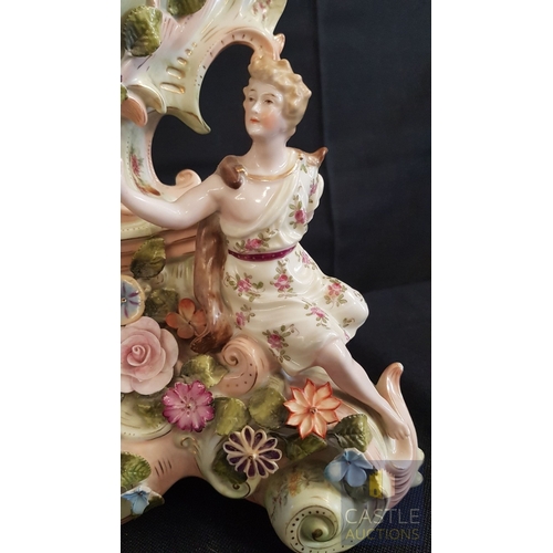 1 - A Decorative Continental Porcelain Mantel Clock, Richly Modelled with Applied Flowers, Scrollwork an... 