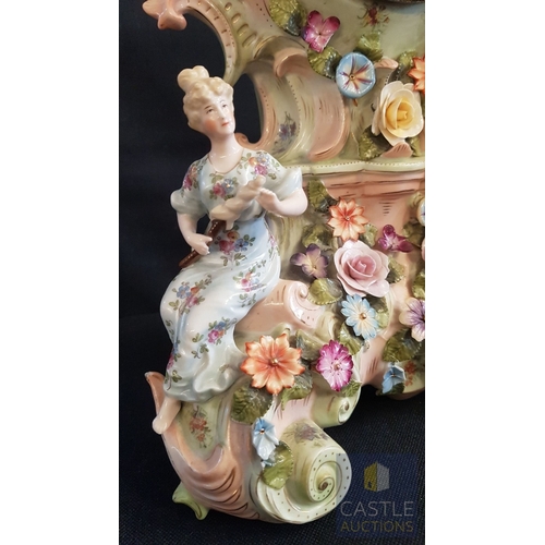 1 - A Decorative Continental Porcelain Mantel Clock, Richly Modelled with Applied Flowers, Scrollwork an... 