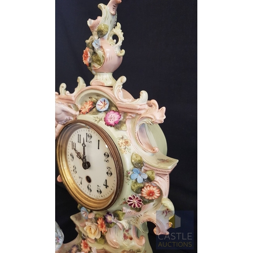 1 - A Decorative Continental Porcelain Mantel Clock, Richly Modelled with Applied Flowers, Scrollwork an... 