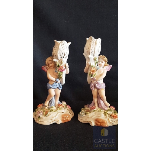 2 - Continental Porcelain Opposing Pair of Figural Candle Holders of Cherubs / Putti with Floral Decorat... 