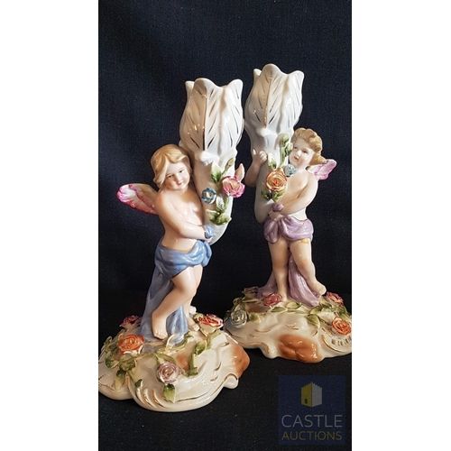 2 - Continental Porcelain Opposing Pair of Figural Candle Holders of Cherubs / Putti with Floral Decorat... 