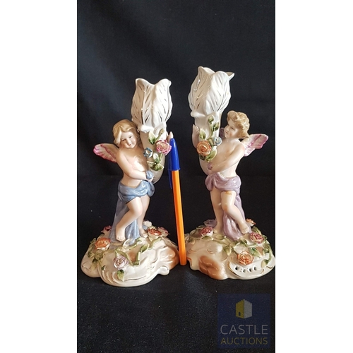 2 - Continental Porcelain Opposing Pair of Figural Candle Holders of Cherubs / Putti with Floral Decorat... 