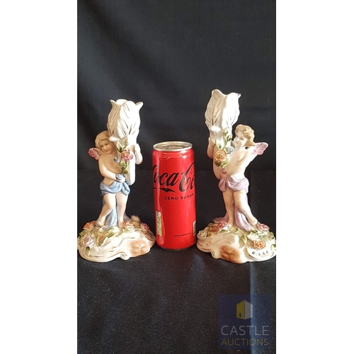 2 - Continental Porcelain Opposing Pair of Figural Candle Holders of Cherubs / Putti with Floral Decorat... 