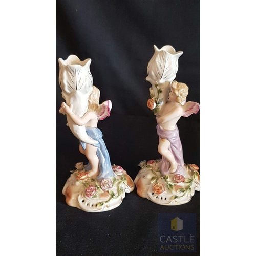 2 - Continental Porcelain Opposing Pair of Figural Candle Holders of Cherubs / Putti with Floral Decorat... 