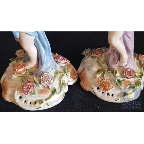 2 - Continental Porcelain Opposing Pair of Figural Candle Holders of Cherubs / Putti with Floral Decorat... 