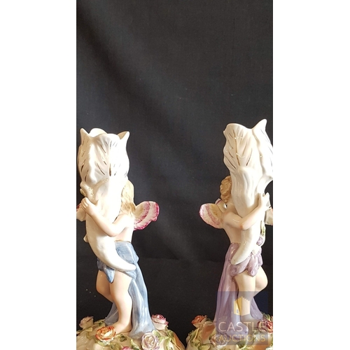 2 - Continental Porcelain Opposing Pair of Figural Candle Holders of Cherubs / Putti with Floral Decorat... 