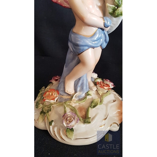 2 - Continental Porcelain Opposing Pair of Figural Candle Holders of Cherubs / Putti with Floral Decorat... 