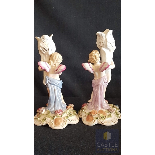 2 - Continental Porcelain Opposing Pair of Figural Candle Holders of Cherubs / Putti with Floral Decorat... 