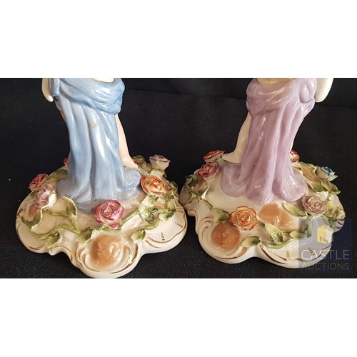 2 - Continental Porcelain Opposing Pair of Figural Candle Holders of Cherubs / Putti with Floral Decorat... 