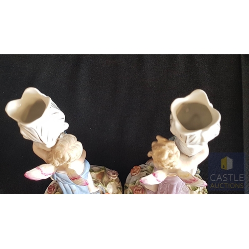 2 - Continental Porcelain Opposing Pair of Figural Candle Holders of Cherubs / Putti with Floral Decorat... 