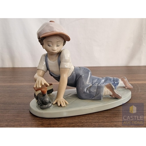 204 - Lladro Porcelain Figurine 'All Aboard' (#7619), of Boy with Train, 1992 Lladro Collector's Society P... 
