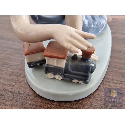 204 - Lladro Porcelain Figurine 'All Aboard' (#7619), of Boy with Train, 1992 Lladro Collector's Society P... 