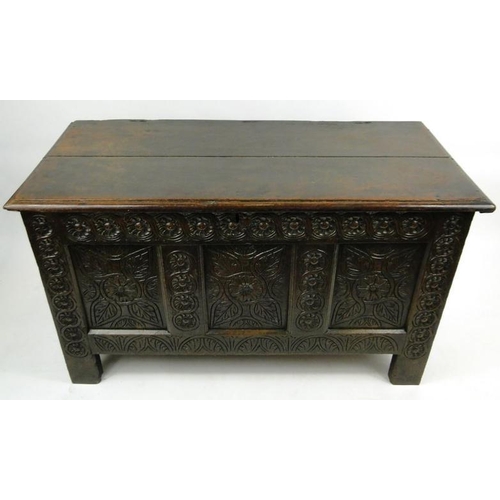 17 - Large antique oak coffer with floral carved front