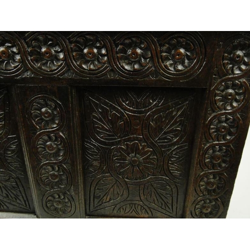 17 - Large antique oak coffer with floral carved front