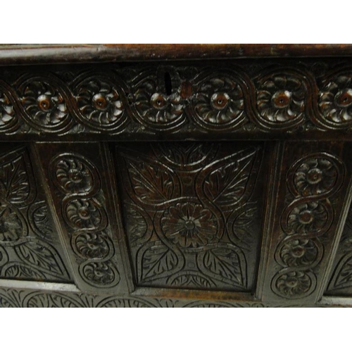 17 - Large antique oak coffer with floral carved front