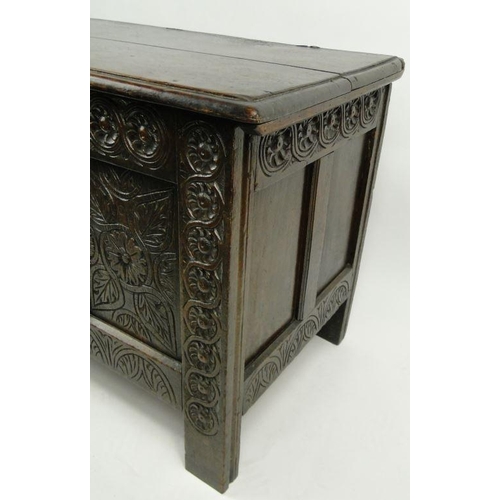 17 - Large antique oak coffer with floral carved front