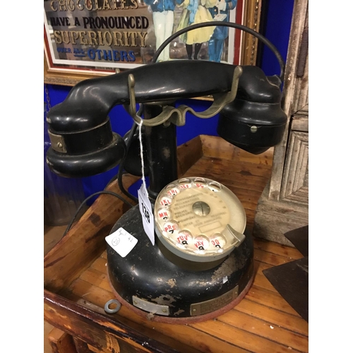 138 - Early 19th. C. Bakelite and metal telephone.