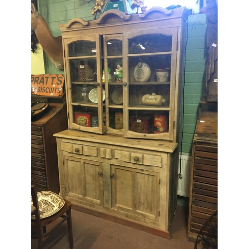 525 - 19th. C. stripped pine kitchen cupboard with two glazed doors over two drawers and two door. (139 cm... 