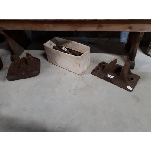 9 - Two Cast iron railway clamps.