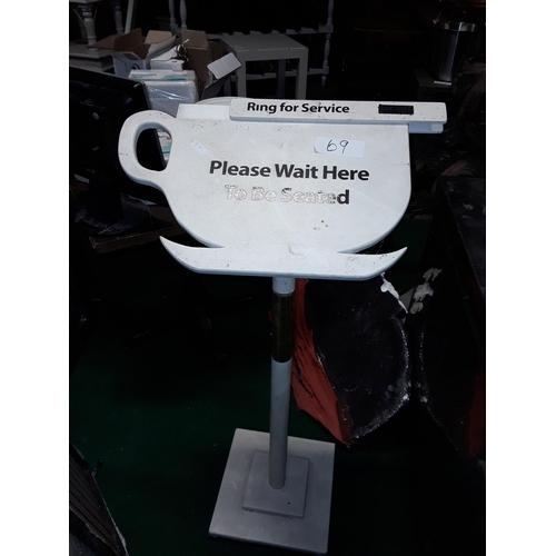 69 - Please wait to be seated floor sign