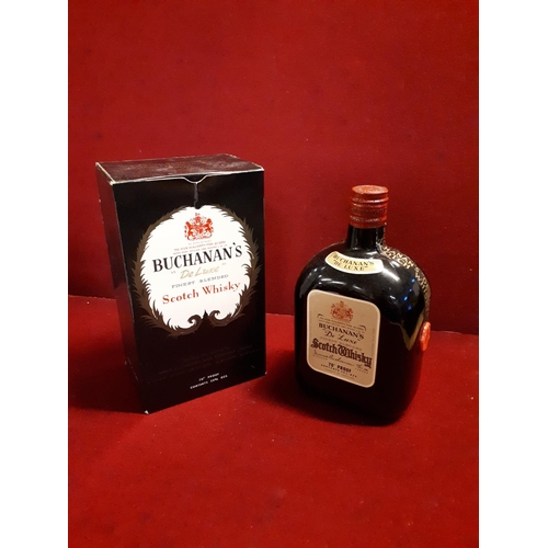 63 - An old bottle of the famous Buchanan's blended whisky. We believe this is from the 1950s.