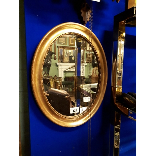 121 - Oval guilt wood wall mirror.