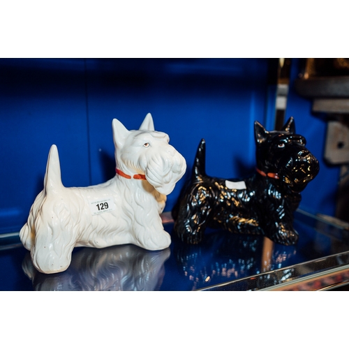 129 - Two ceramic models of Scottie dogs.