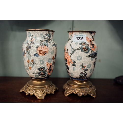 172 - Pair of Oriental vases with cloisonn? decoration and brass bases.