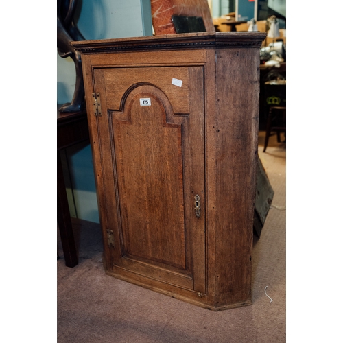 175 - Early 19th C. oak wall mounted corner cupboard with single door {102 cm H x 83 cm W x 51 cm D}.