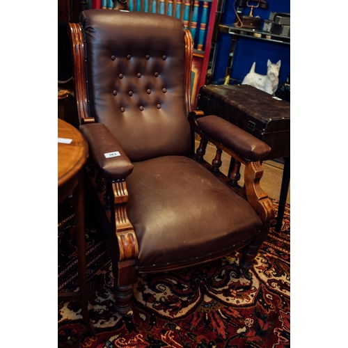 183 - Edwardian mahogany open arm chair on turned legs.