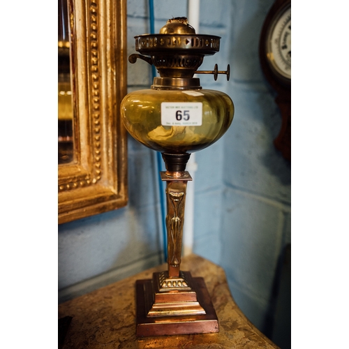 65 - Copper and brass Art Nouveau oil lamp with irradescent glass bowl.